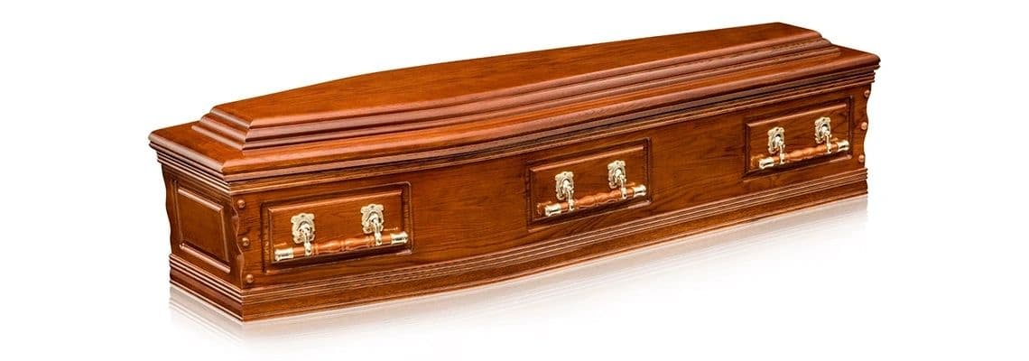 Elegant wooden coffin with polished finish and brass handles.
