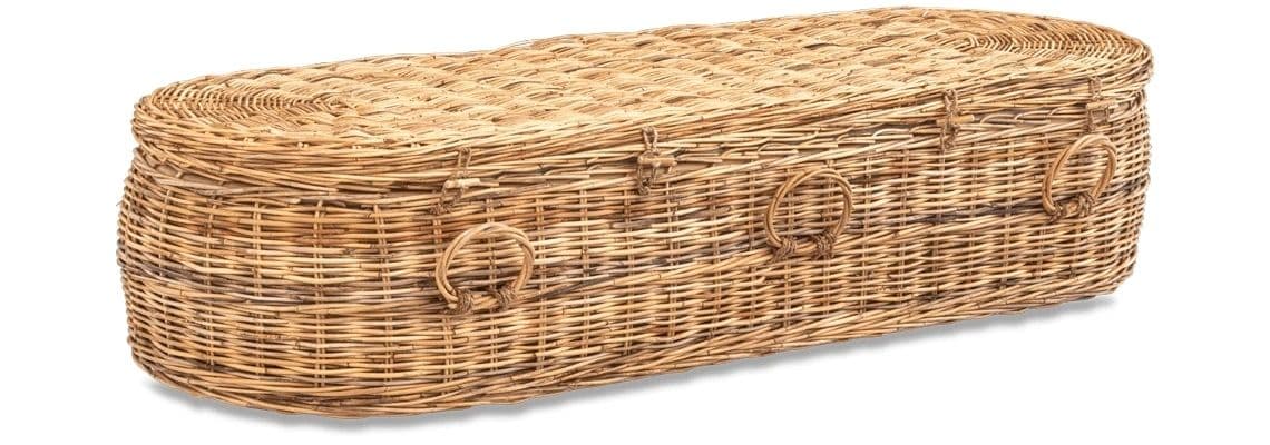 Handwoven wicker coffin with rounded edges and handles.